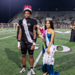 Homecoming King Thony Tshitenge and Queen Mattie Jones stand at the 50-yard line after being crowned during the halftime ceremony in Daikin Stadium on Sept. 13, 2024. The Waller Bulldog football team wins their first homecoming game in nearly a decade, over Houston Westside, for the Bulldog’s second victory of the 2024 campaign, at Daikin Stadium in Waller, Sept. 13, 2024. (Photo by Creighton Holub, courtesy RoninVisuals.com)